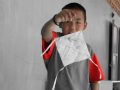 Student showing his paper kite